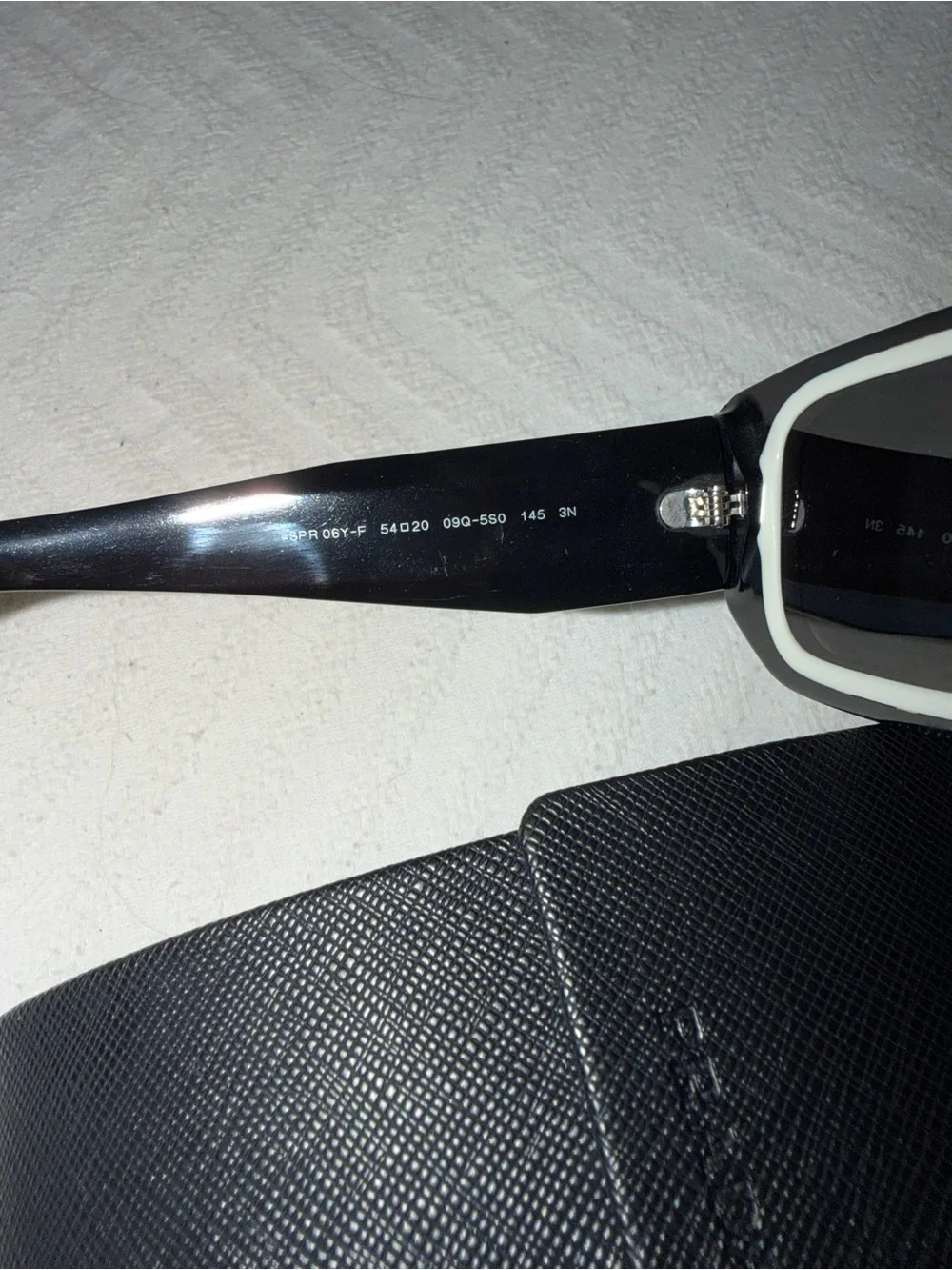 Prada Black Rectangular Sunglasses with White Inner Trim